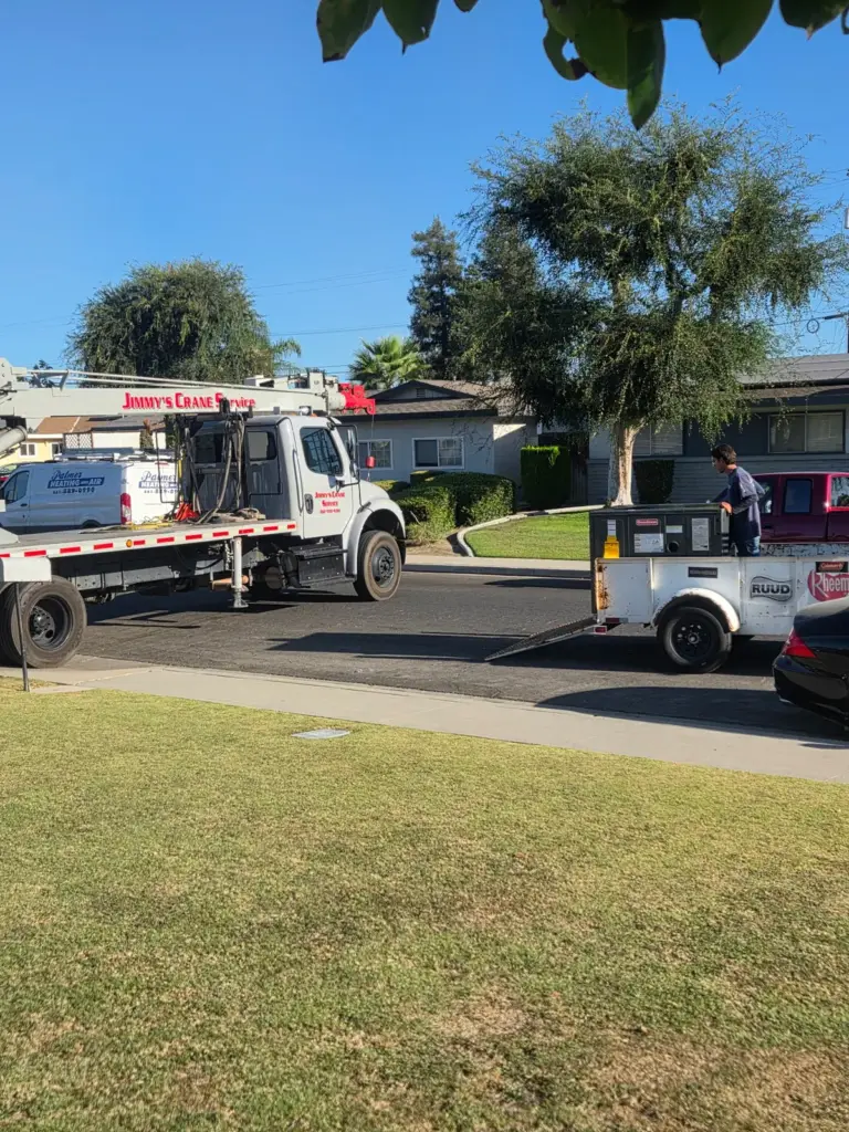 Crane truck staged for a rooftop HVAC install