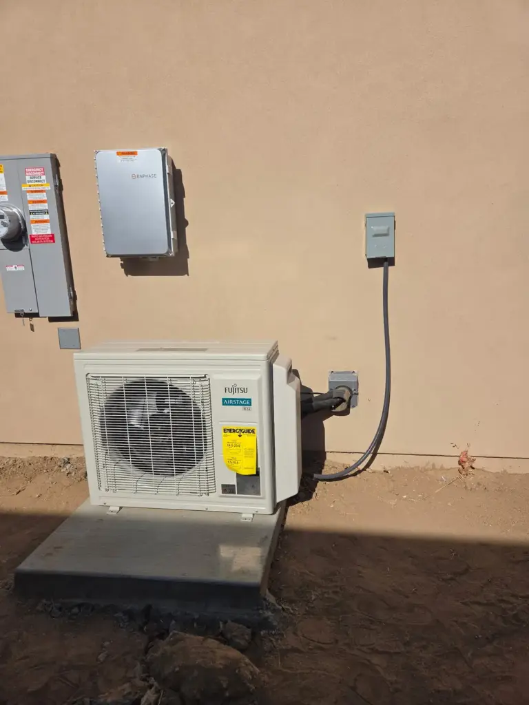 Wall-mounted mini-split outdoor unit installed by Palmer