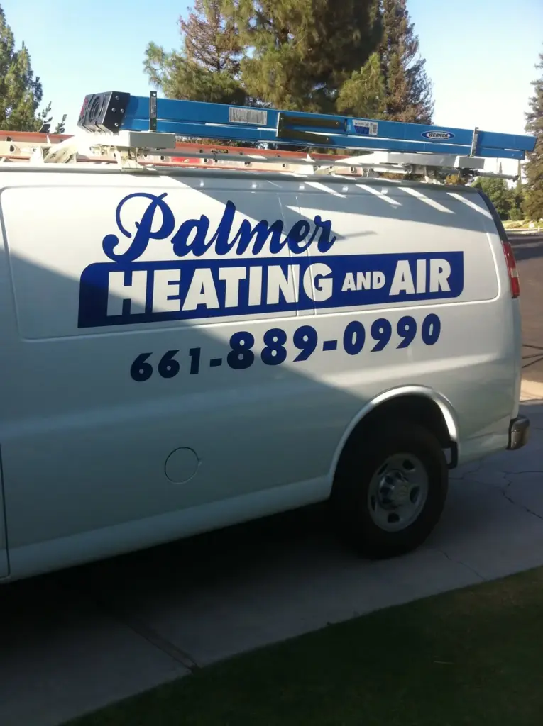 Palmer Heating and Air service van with the phone number (661) 889-0990