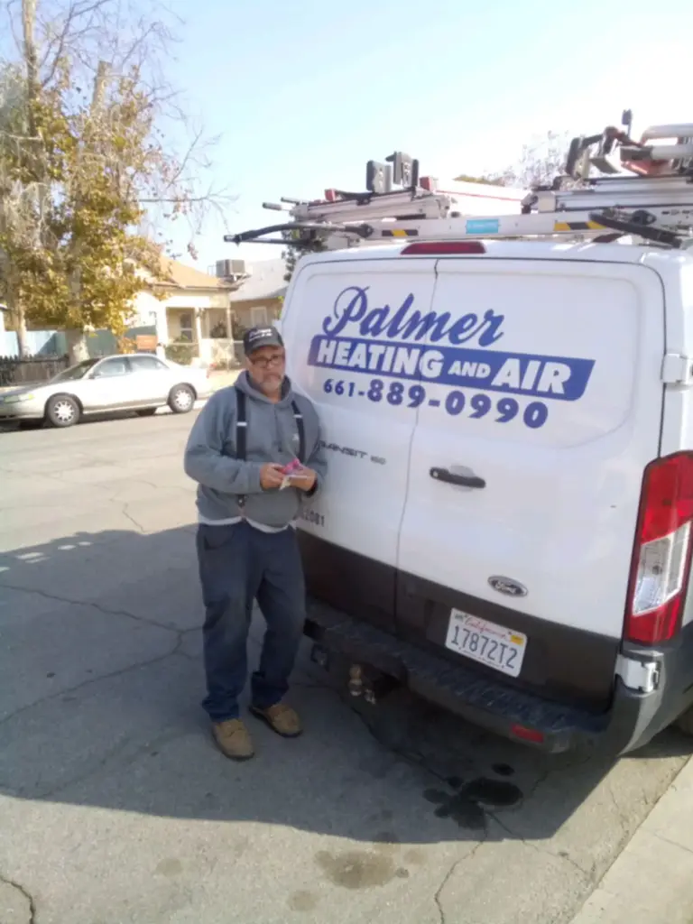 Mark Palmer, owner of Palmer Heating and Air, with his service van in Bakersfield